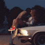 Kiss on the car hood